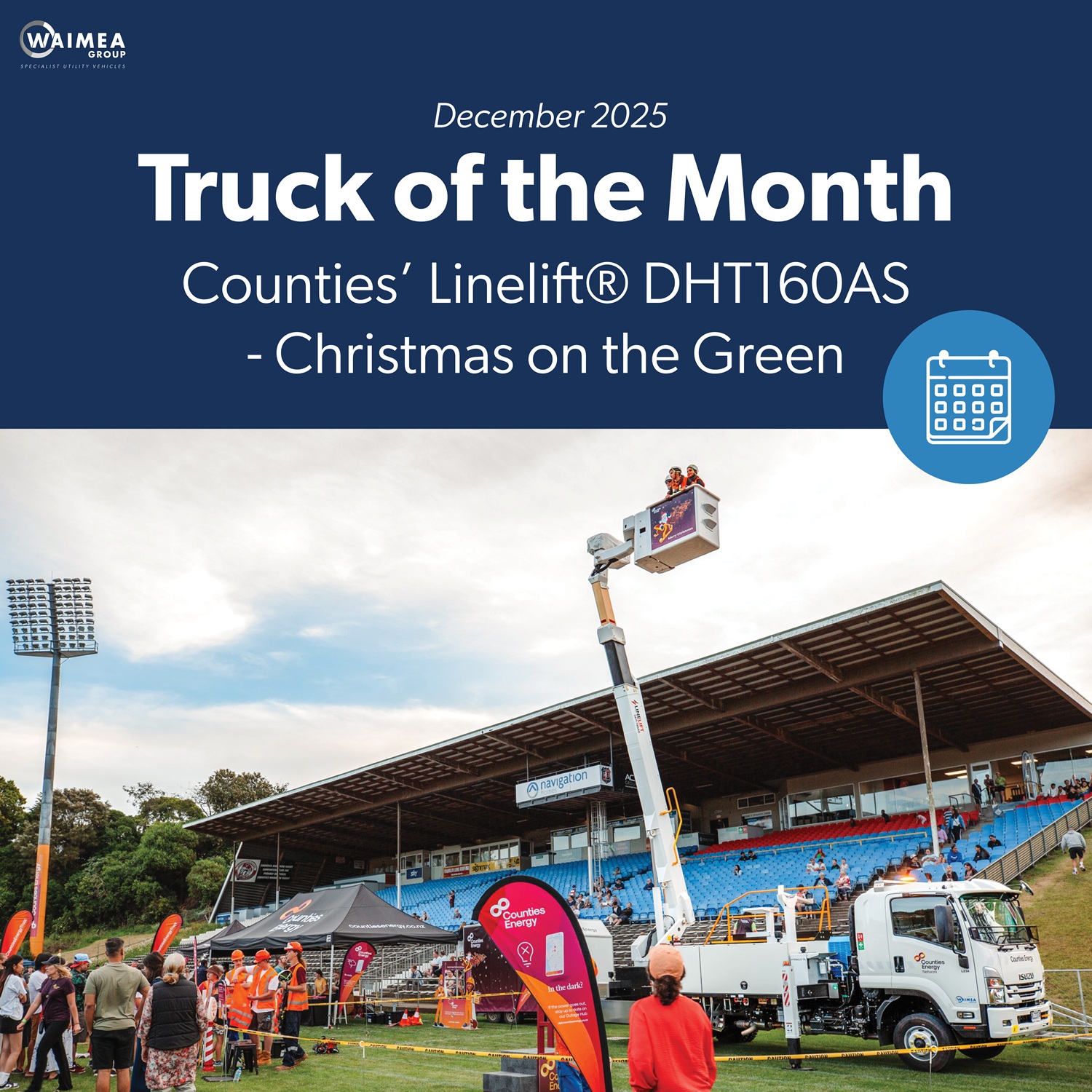 A bucket truck EWP giving rides to children advertising Counties Energy.