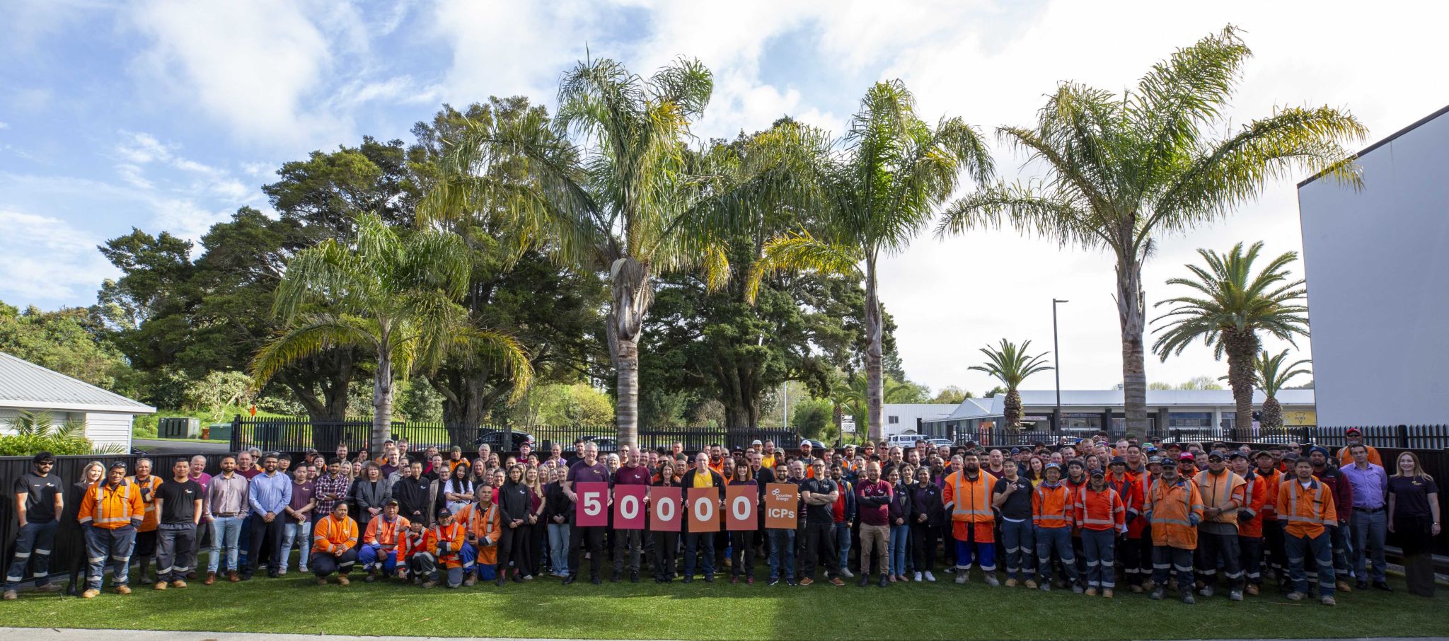 A bucket truck EWP giving rides to children advertising Counties Energy.